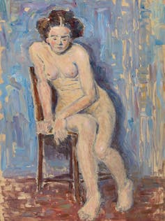 A naked woman sitting on a chair