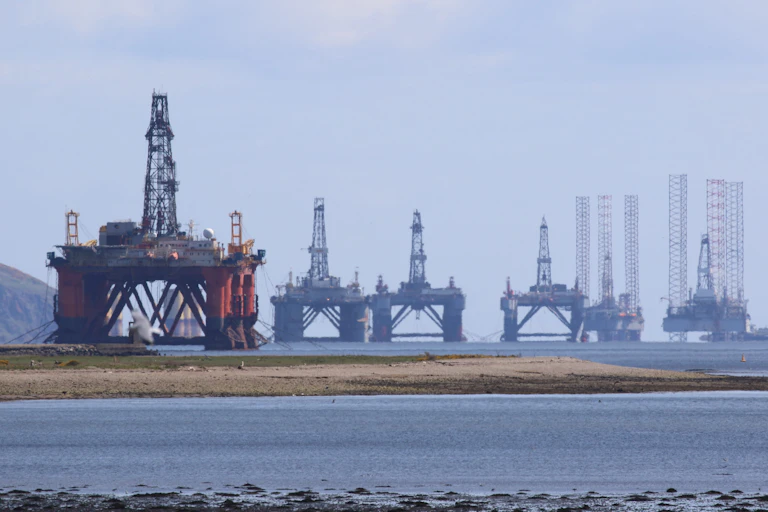 abandoned oil rigs in a shallow estuary