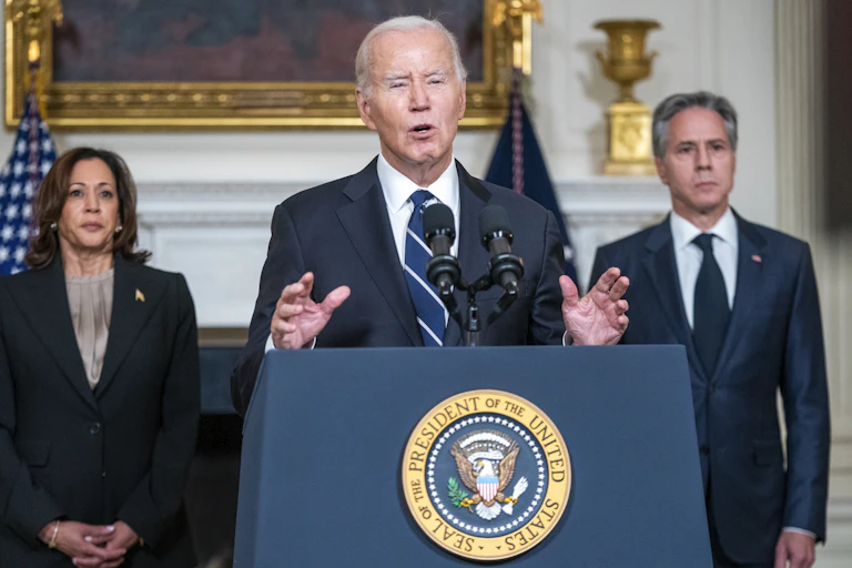 US president Joe Biden speaking at a lectern.