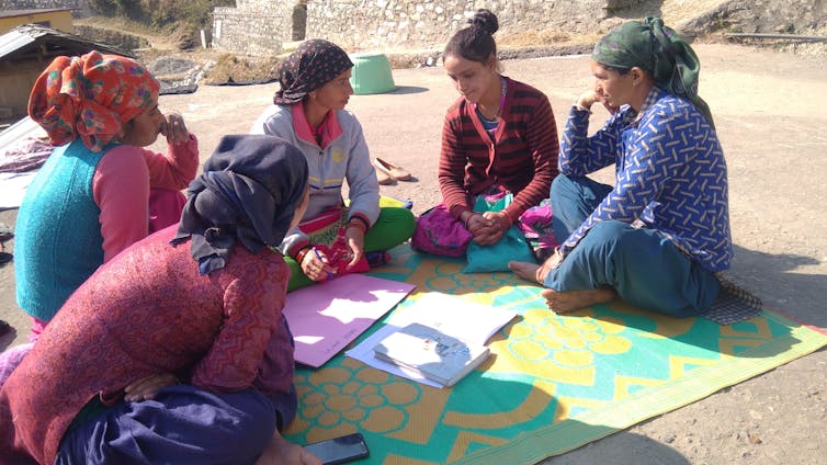 A group of women in a North Indian community talking.