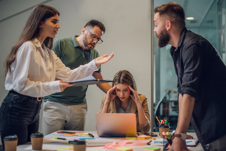 workers arguing around a table