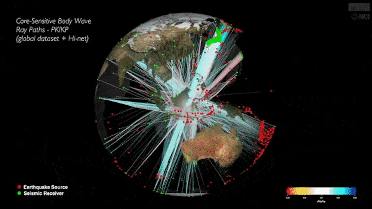 An animation showing Earth dotted with seismographs and a model of the core.