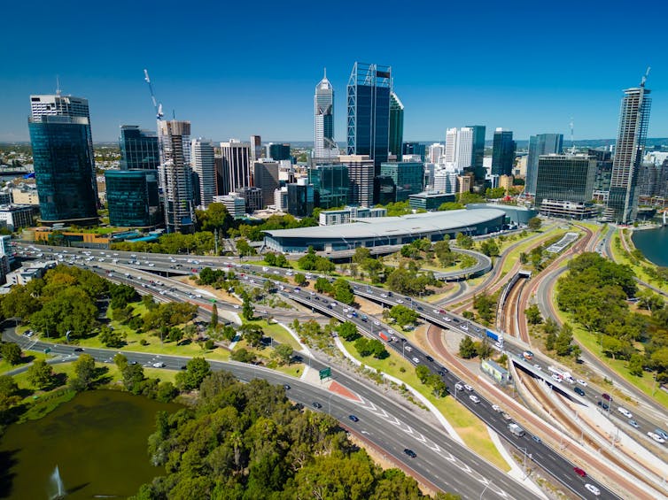 Perth, Western Australia, seen from Kings Park. Freeways and a city skyline and a park.