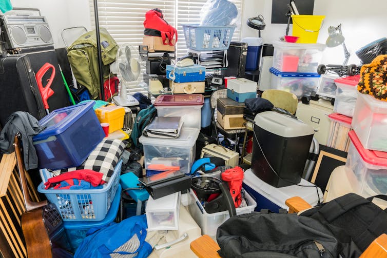 A room is filled wall-to-wall with electronic equipment and other items.