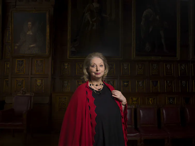 Hilary Mantel wearing red.