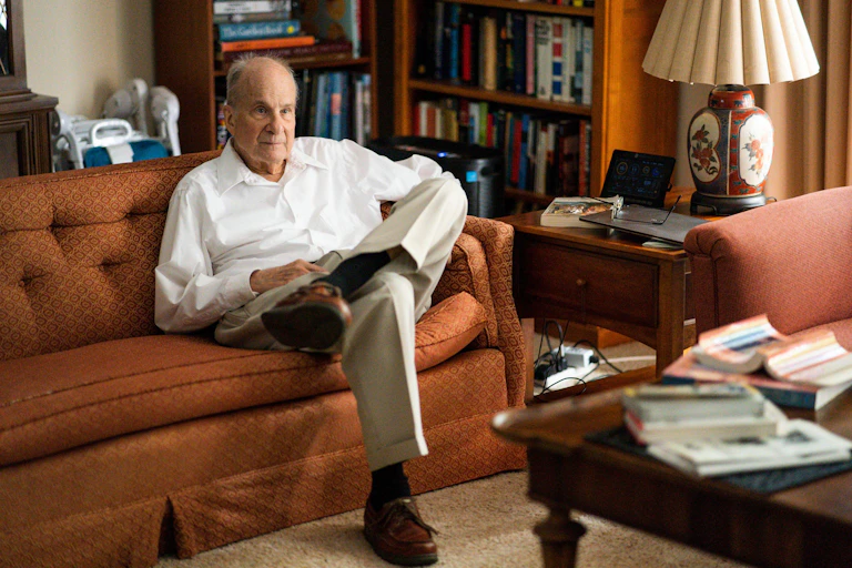 Louis Brus on his sofa.