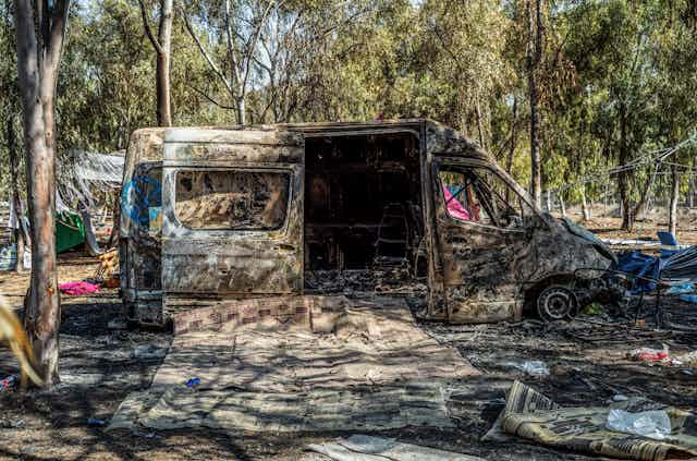 Remain of a burnt out vehicle.