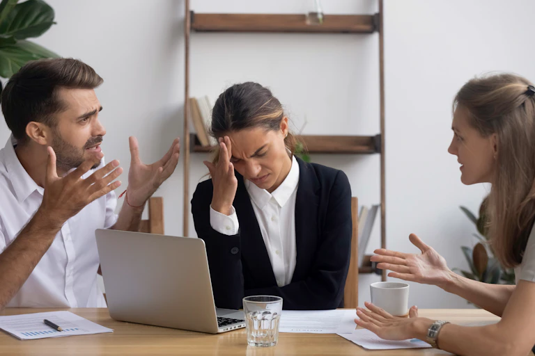 A man and a woman have an argument in front of a woman