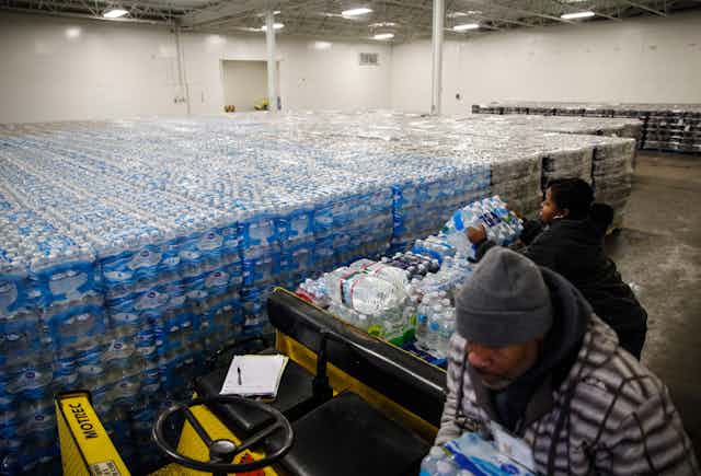 Pallets of bottled water are seen ready for distribution in a Michigan warehouse.