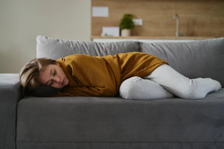A woman lying on a couch
