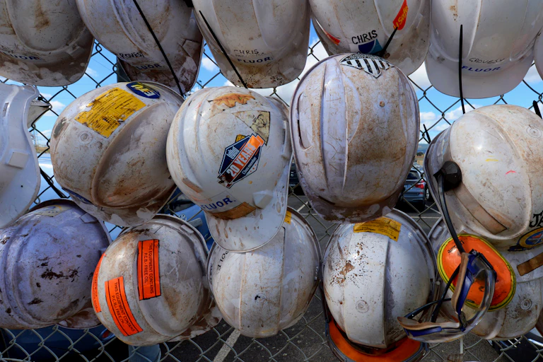 Workers hats hang on the fence outside the Hazelwood power station, March 2017.