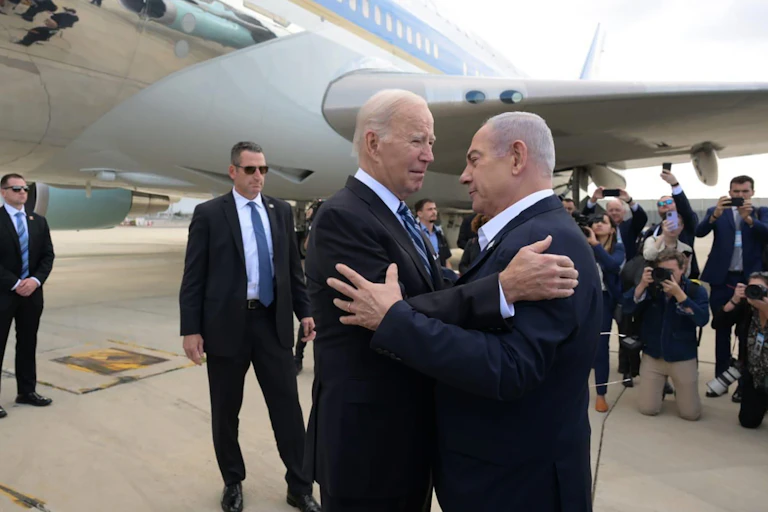 Joe Biden and Benjamin Netanyahu greet each other as Biden arrives in Israel, October 18 2023.