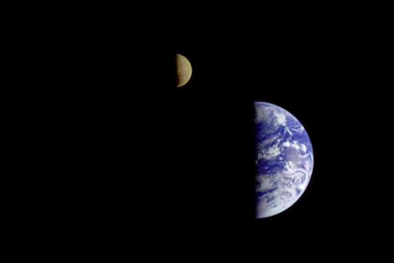Earth and Moon as seen by the Galileo spacecraft from a distance of 6 million km away