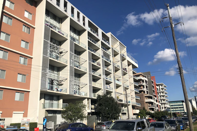 A street with a row of apartment buildings in Liverpool, Western Sydney