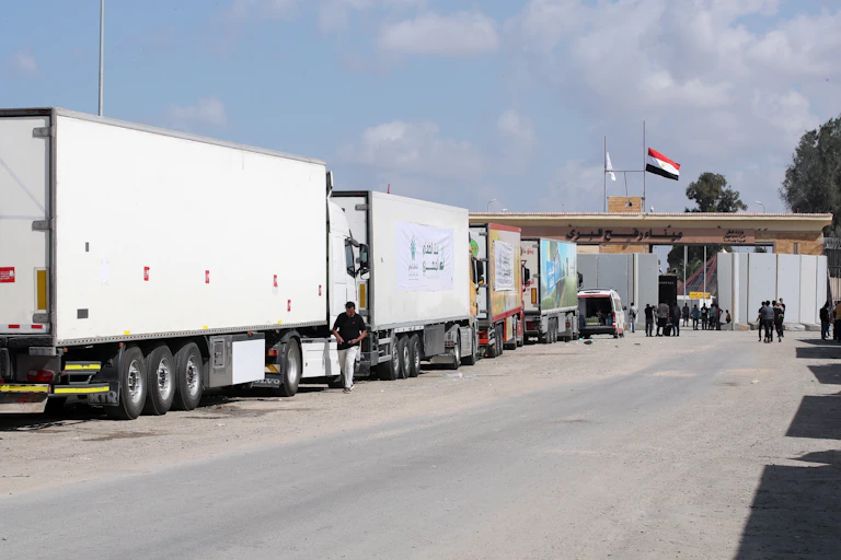 Lorries queue at a border crossing between Egpyt and the Gaza Strip, October 20 2023.