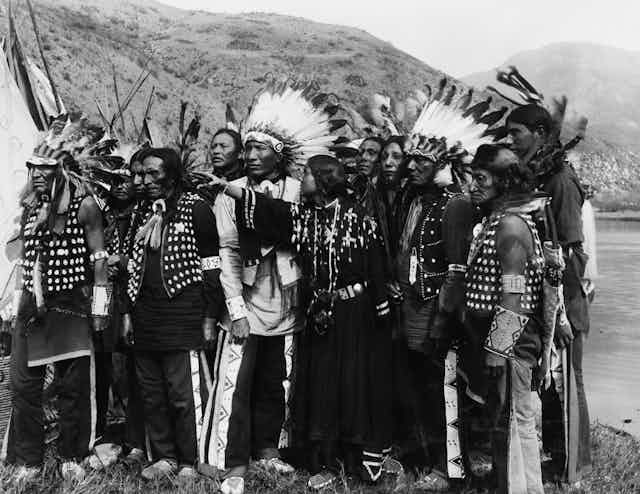 A group of American Indians in traditional dress