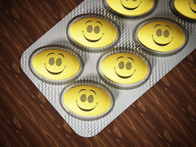 Antidepressant pill with smiling face in blister pack.