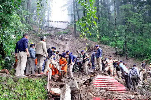 Rescue workers on top of a landslide