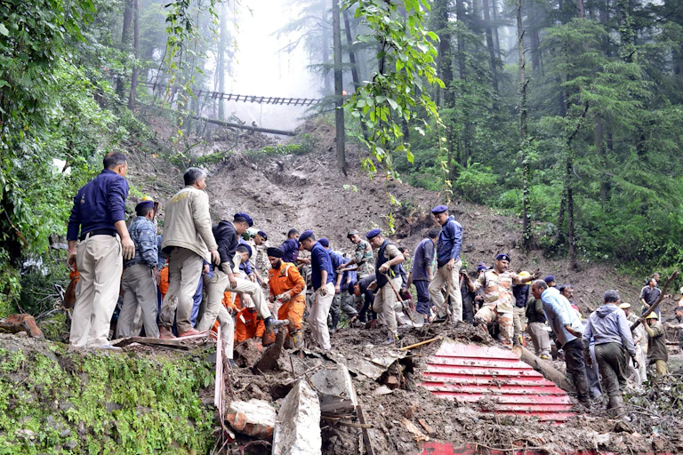 Rescue workers on top of a landslide