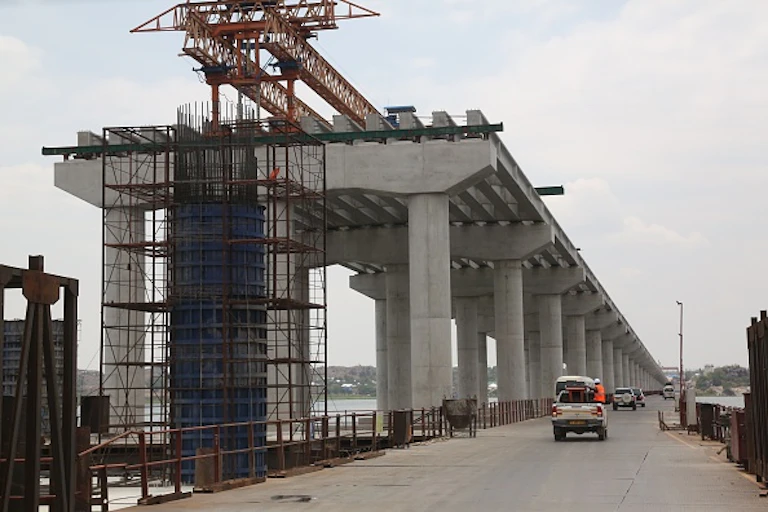 A photo of a bridge that is undergoing construction over Lake Victoria, Tanzania, as part of the Belt and Road Initiative