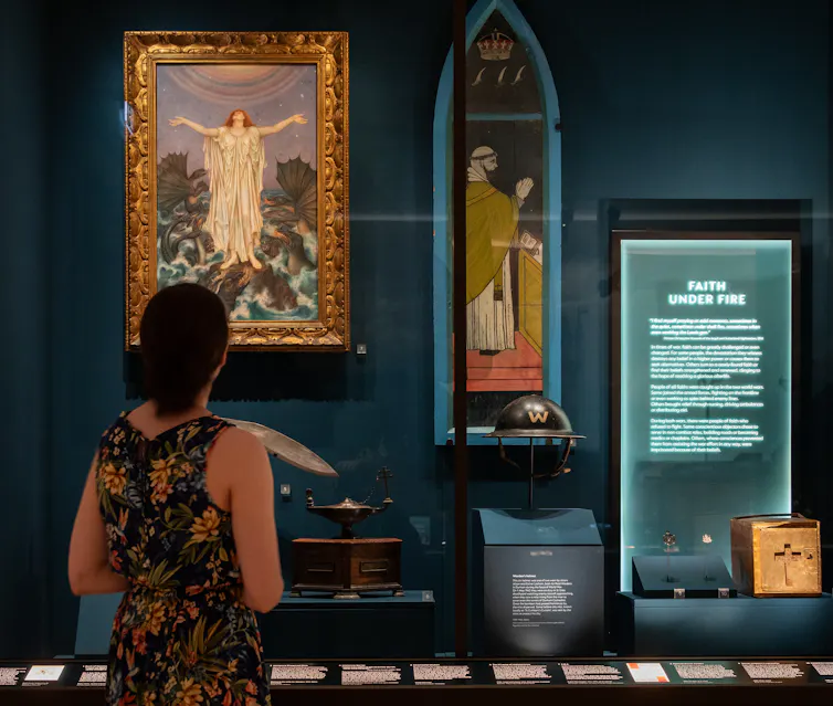 Woman looks at displays in the museum