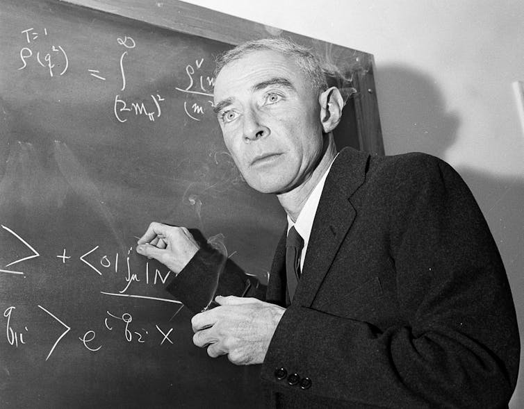 A scientist at a blackboard.