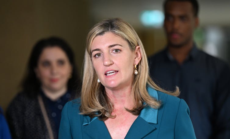 A woman addressing the media in a press conference