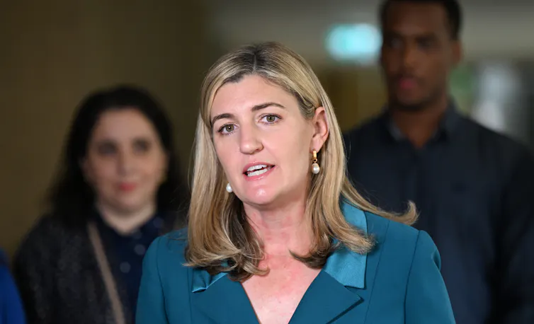 A woman addressing the media in a press conference