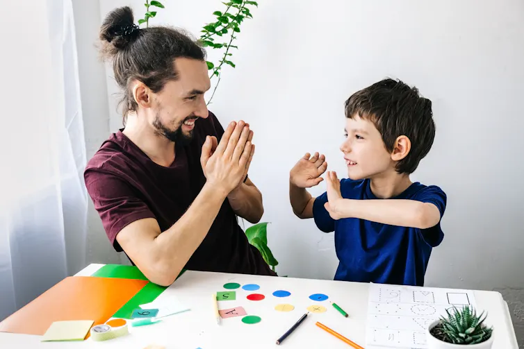 Therapist talks to boy with ADHD