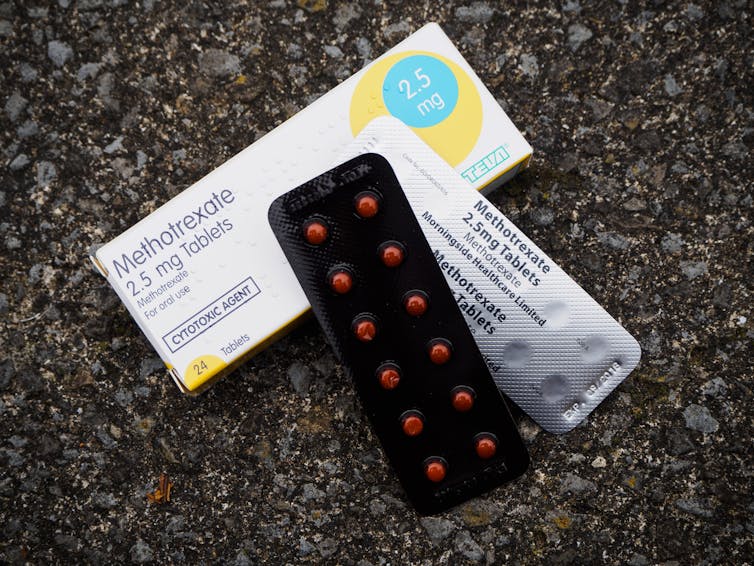 A box of methotrexate with two packets of the tablets resting on top.