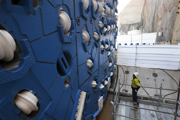 Snowy Hydro tunnelling machine up close and worker