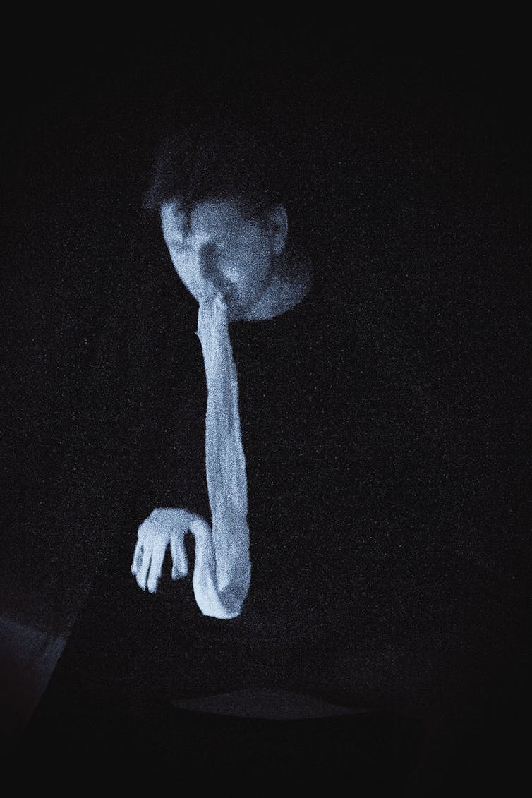 Character seen with a ghostly translucent substance coming out of his mouth.