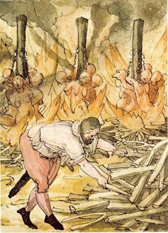 An illustration of witches being burned while a man stokes the fire.