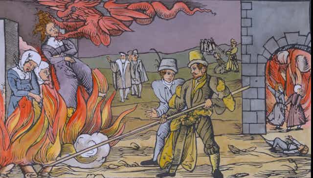 Women being burned at the stake while men stoke the fires.