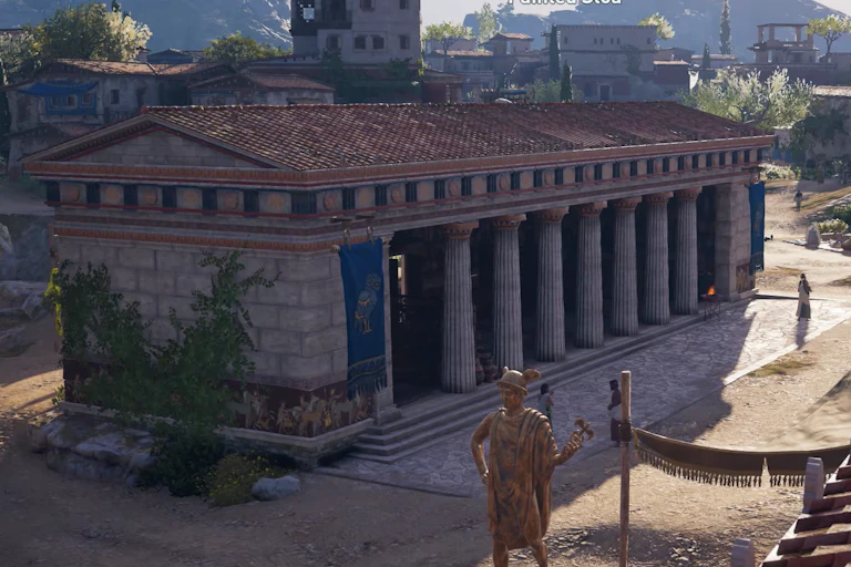 Un edificio rodeado de columnas en medio de una serie de calles amplias y peatonales