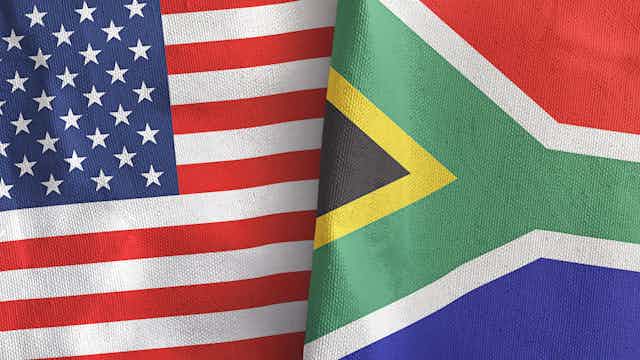 An American flag juxtaposed with a South African flag.