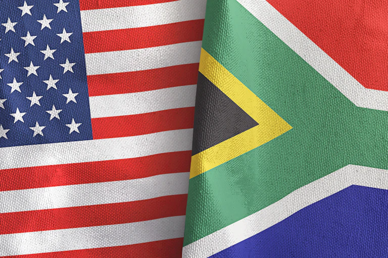 An American flag juxtaposed with a South African flag.