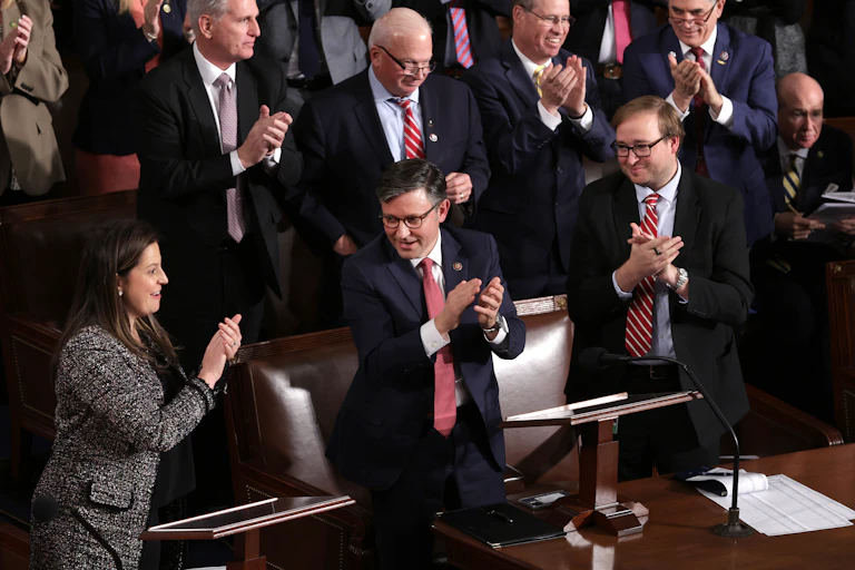 People standing and clapping.