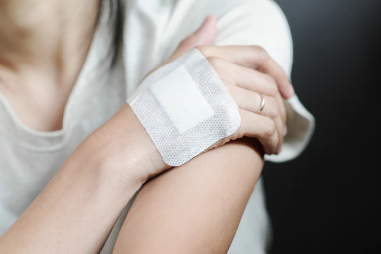 Woman with dressing on her hand