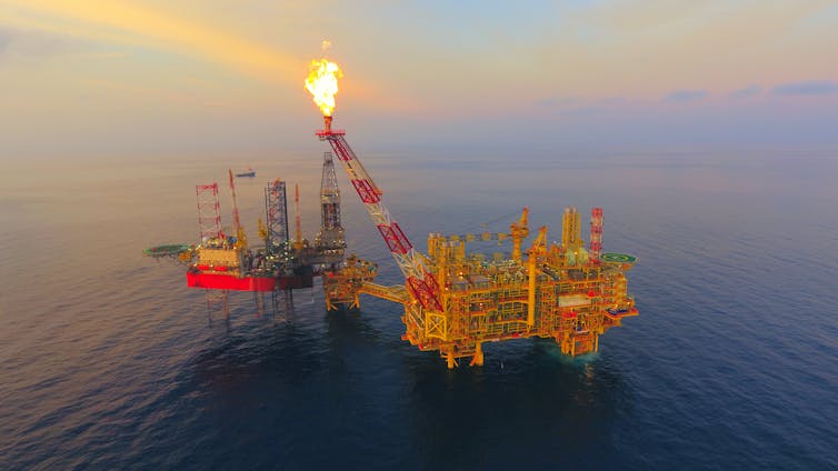 An offshore oil platform flaring gas.