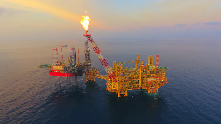 An offshore oil platform flaring gas.