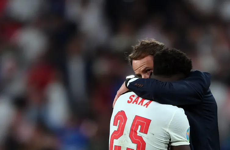Southgate hugging Saka.
