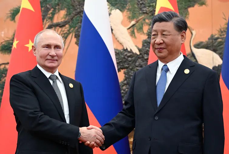 Russian president Vladeimir Putin shakes hands with Chinese president Xi Jinping in Beijing October 2023.