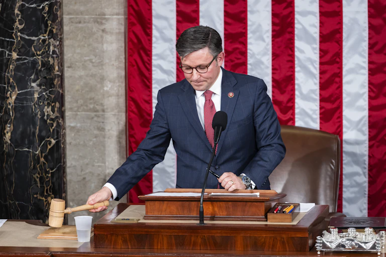 New US House speaker, Mike Johnson, bangs his gavel.