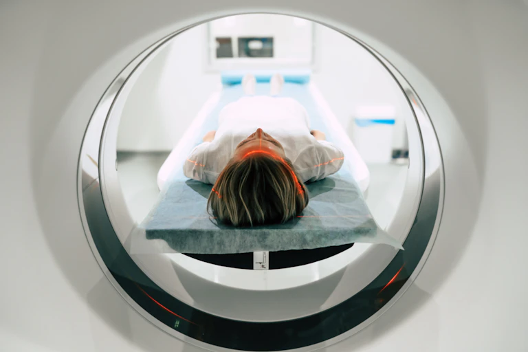 woman lies down for MRI testing