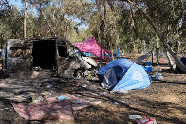 Damaged tents and vans at the site of the Hamas terrorist attack in Israel on October 7.