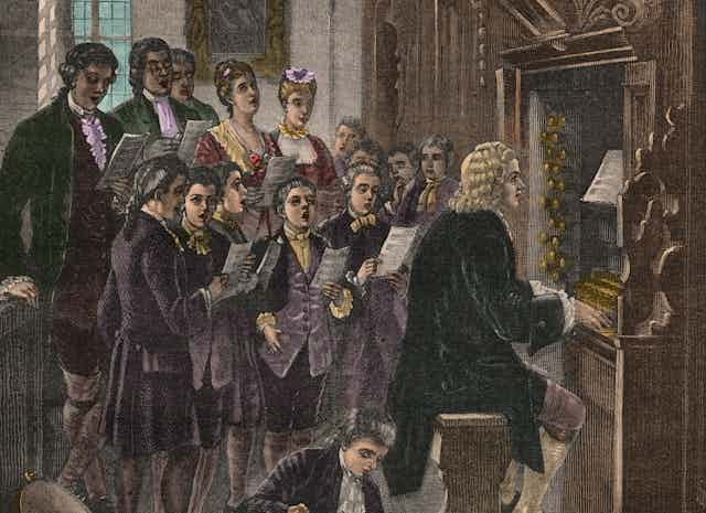 Illustration of man seated at organ while young men and women sing behind him.