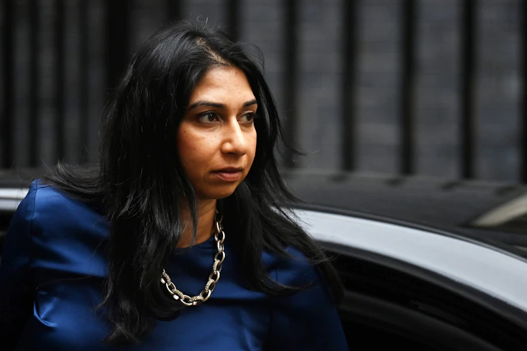 Home secretary Suella Braverman stepping out of a car with a serious expression on her face