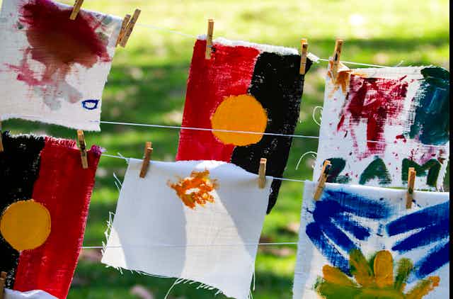 Hand painted Aboriginal flags hung on a line