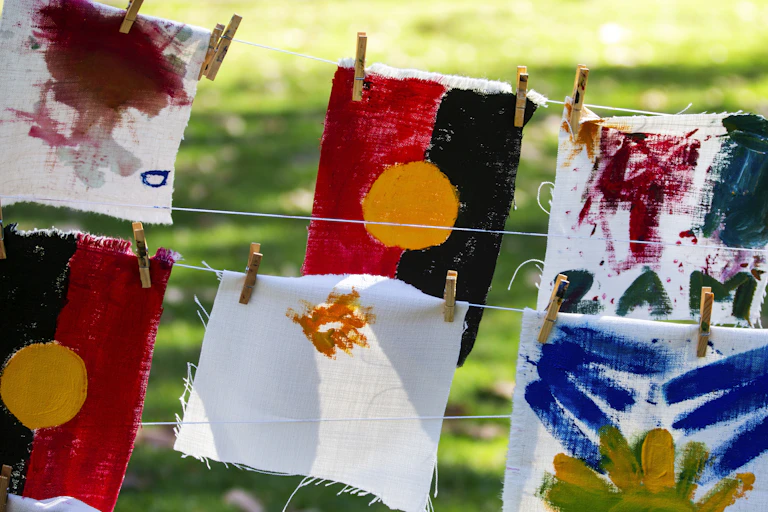 Hand painted Aboriginal flags hung on a line
